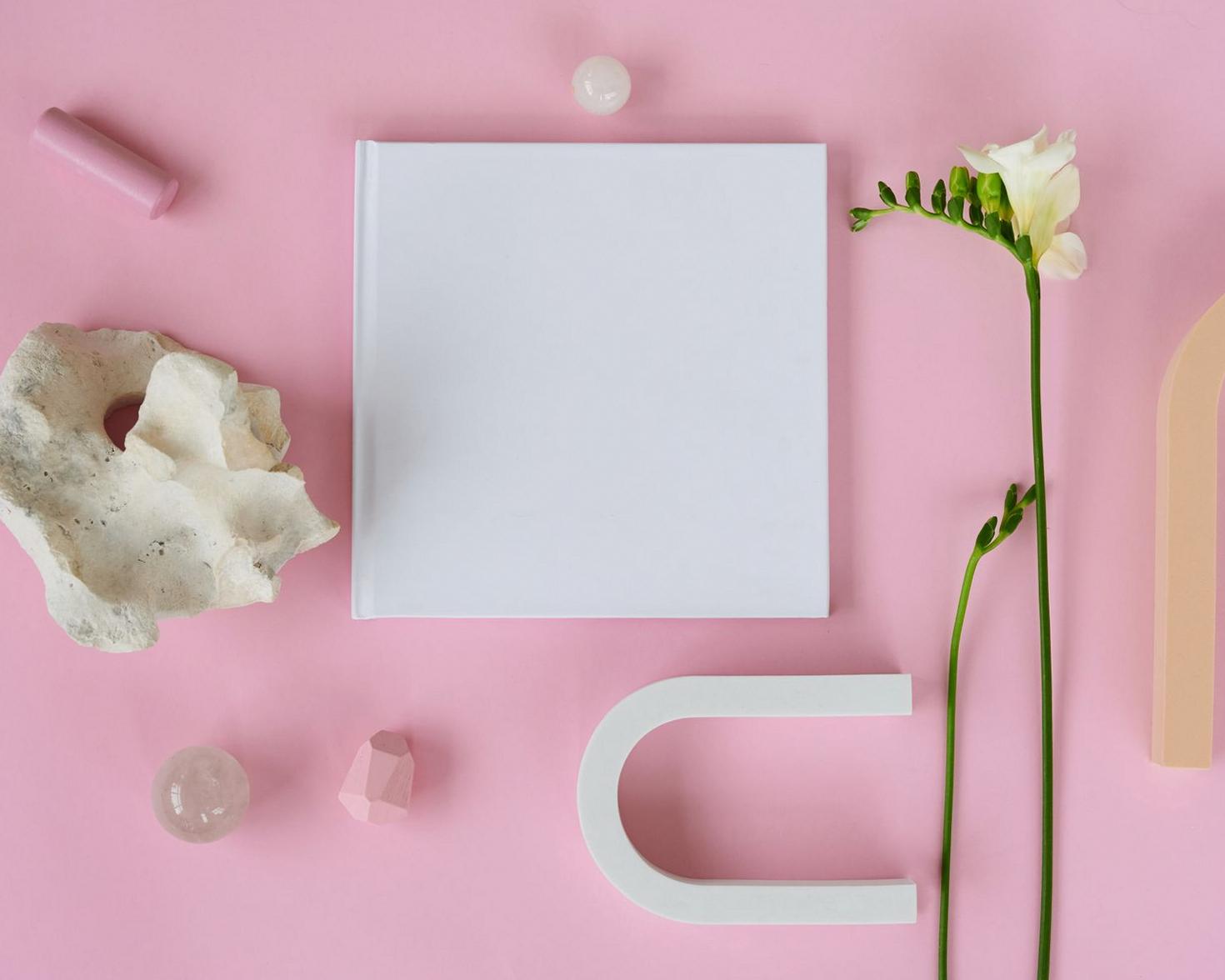 Curated book flatlay with floral accents